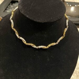 FO Fernando Original stamped vintage necklace sits at the base of neckline